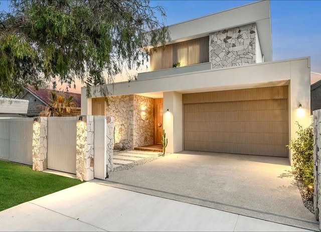 Completed contemporary home with stonework, timber detailing and an integrated garage