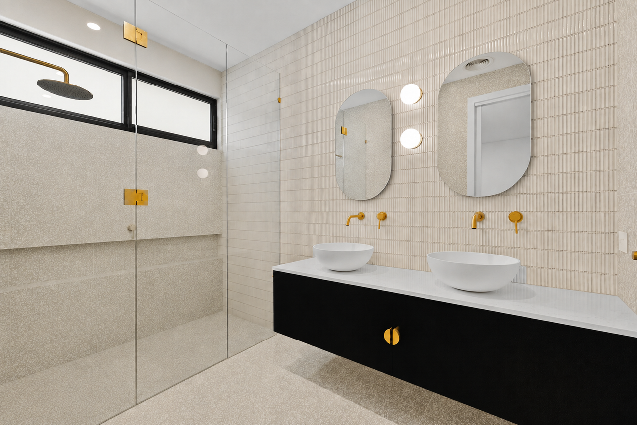 Halibut Avenue ensuite with a round mirror and softly curved vanity