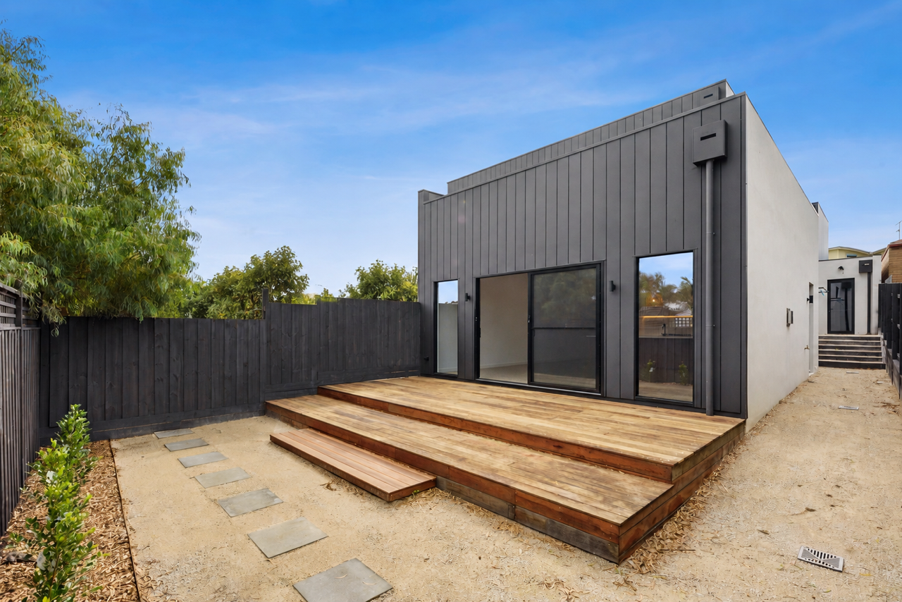Halibut Avenue backyard with a covered outdoor living area