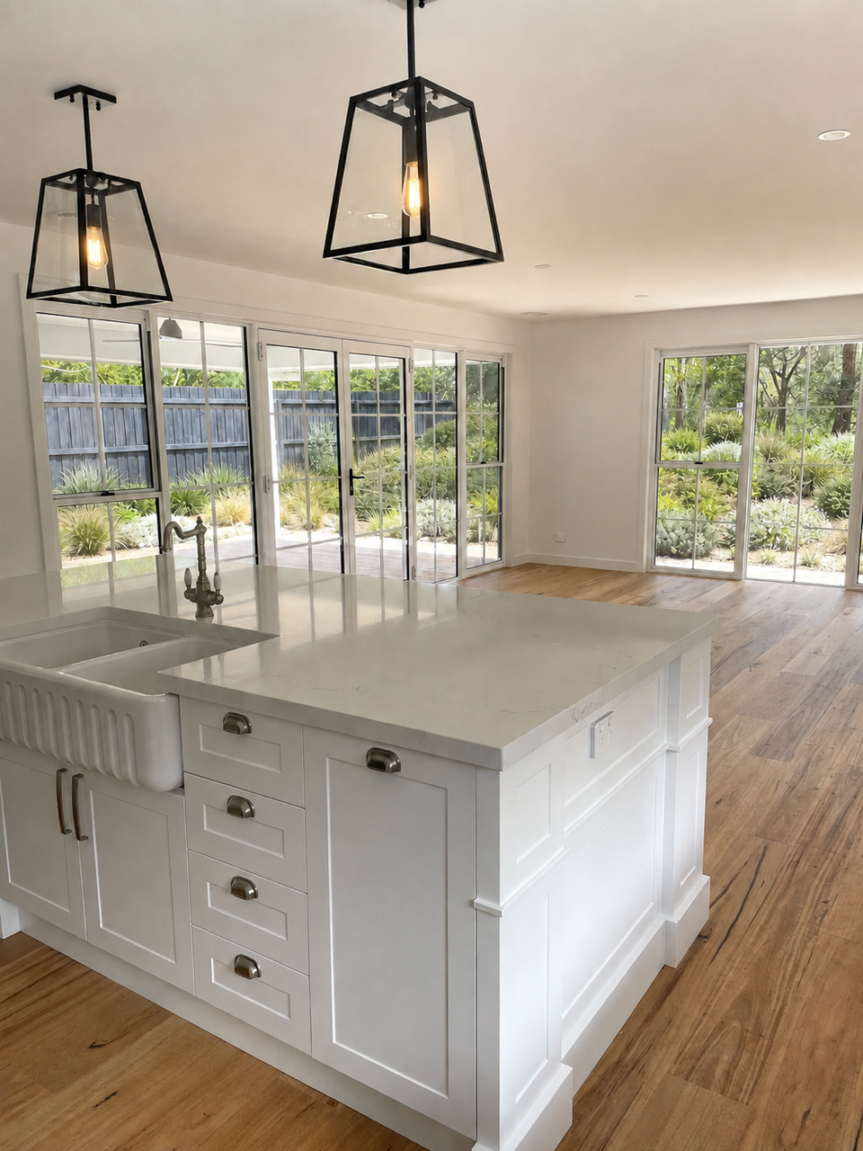 Shell Road living room opening toward the kitchen and garden