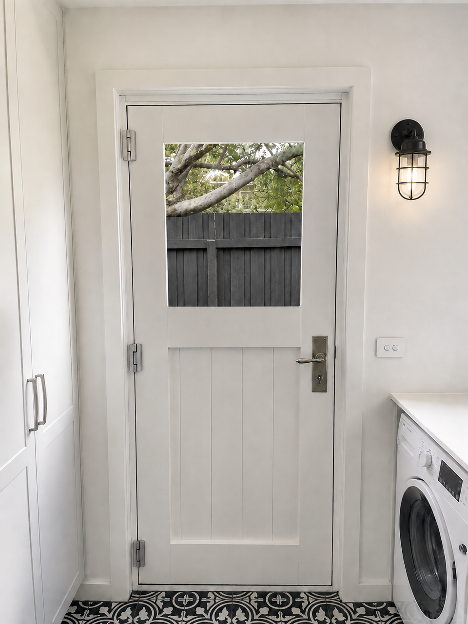 Shell Road laundry with timber joinery and patterned floor tiles