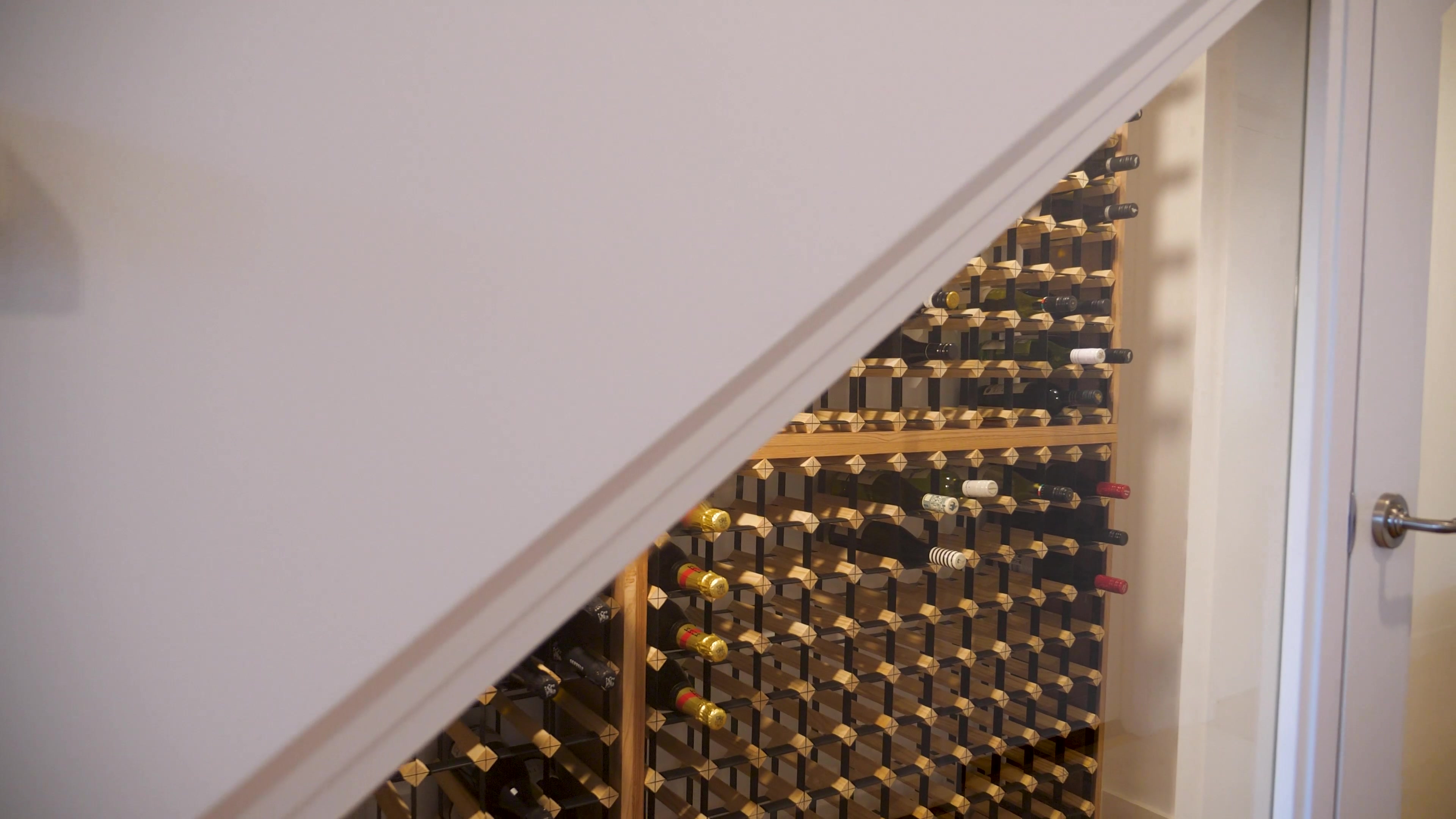 Arched wine storage tucked beneath the Shell Road staircase
